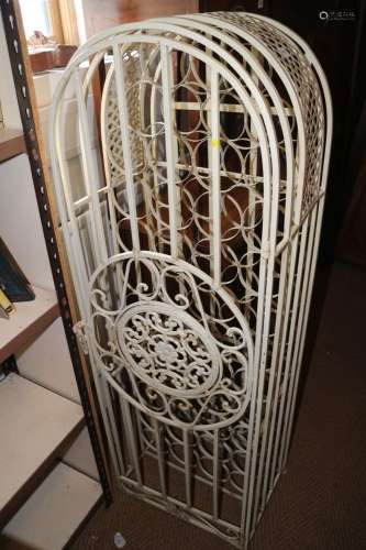A cream painted arch top wrought metal bottle stand, 18 wide...