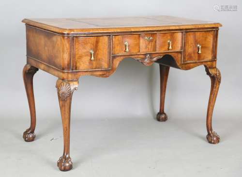 An early 20th century Queen Anne style walnut writing table,...