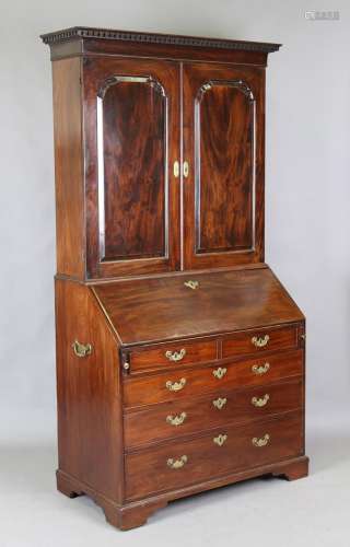 An early George III Cuban mahogany bureau bookcase, the dent...