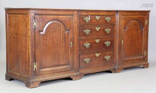 An 18th century oak inverted breakfront dresser base, fitted...