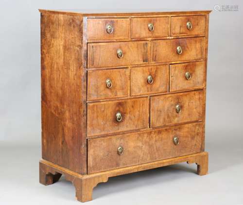 An 18th century style walnut chest of oak-lined drawers with...