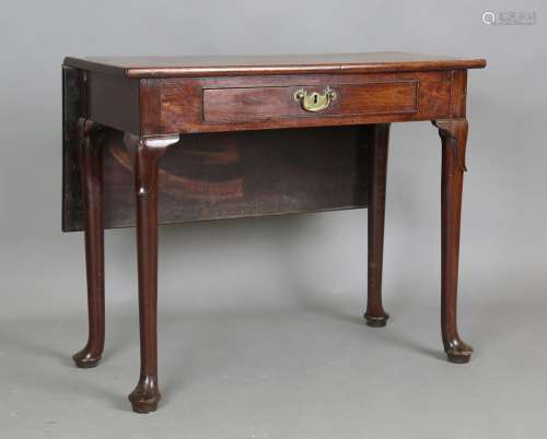 A George II mahogany single drop-flap side table, fitted wit...
