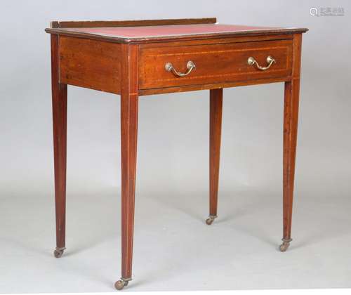 An Edwardian mahogany and satinwood crossbanded writing tabl...