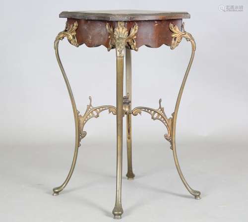 A late 19th century mahogany and cast brass occasional table...