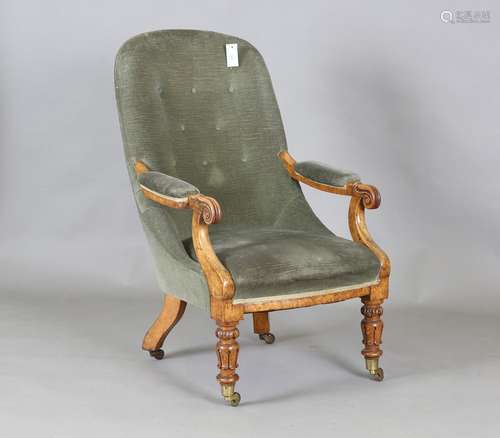 A William IV walnut library armchair with finely carved hand...