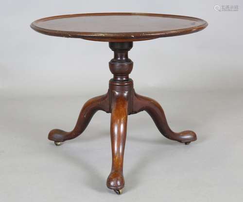 A George III mahogany tripod table base with associated top ...