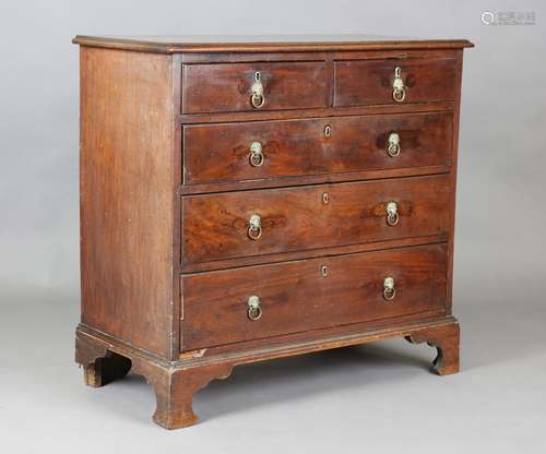 A George III mahogany chest of oak-lined drawers, on bracket...