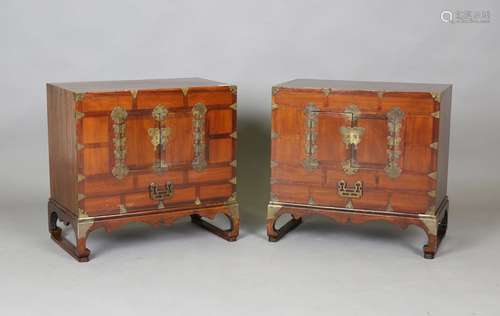 A pair of South-east Asian softwood side cabinets with overa...