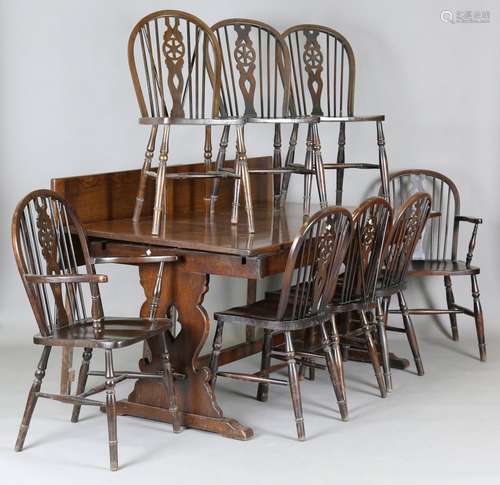 A mid-20th century stained oak draw-leaf dining table, heigh...