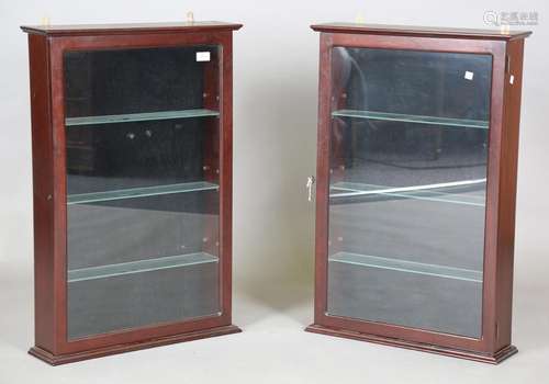 A pair of modern hardwood wall mounted display cabinets, fit...