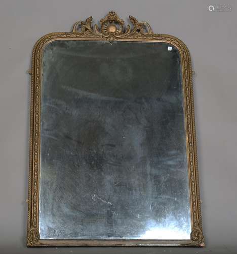 A 19th century gilt composition arched overmantel mirror wit...