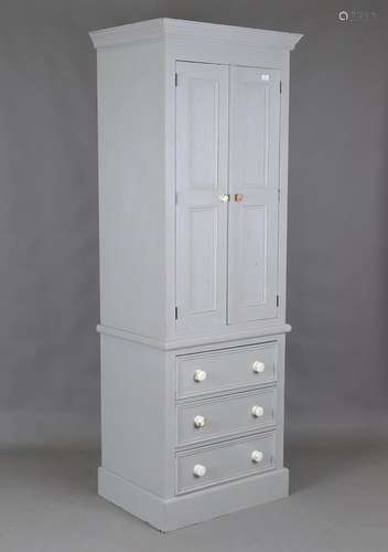 A modern painted pine narrow wardrobe, fitted with two doors...