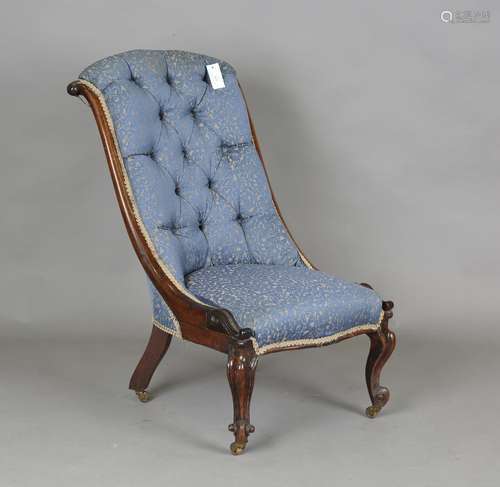 A mid-Victorian walnut showframe slipper chair, raised on ca...