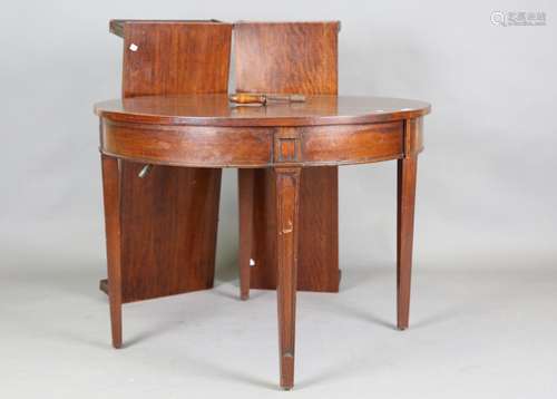 An early 20th century mahogany extending dining table, the c...