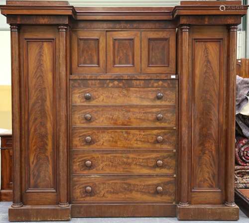 A William IV flame mahogany inverted breakfront wardrobe, fi...