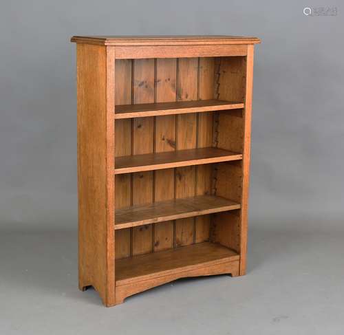 An early 20th century oak open bookcase, fitted with three a...