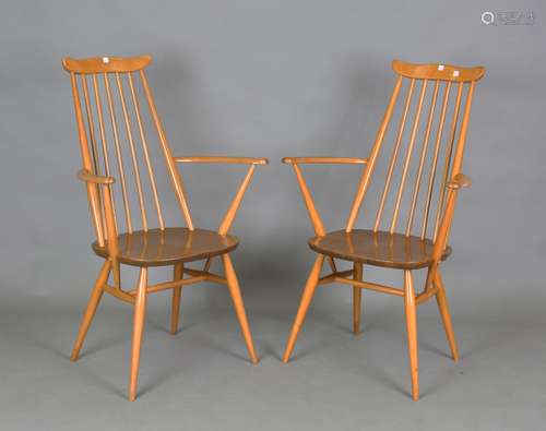 A pair of Ercol beech and elm Windsor type elbow chairs, hei...