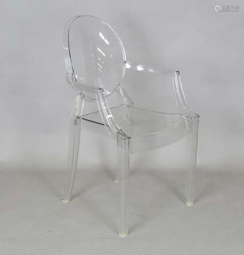 A modern Louis Ghost clear polycarbonate armchair made by Ka...