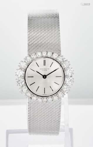 Élégante montre de dame en or blanc, cadran aux reflets gris...