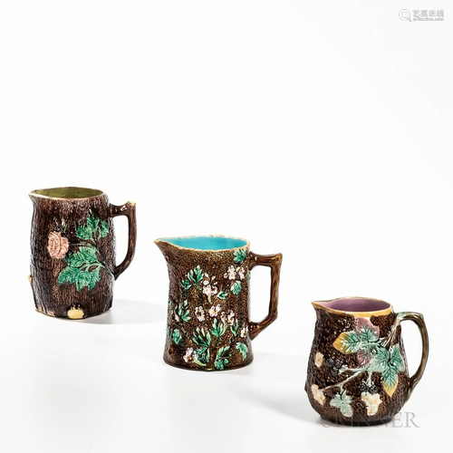 Three Majolica Tree Trunk Molded Jugs, England, c. 1875, one...