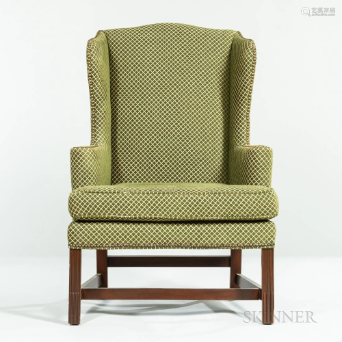 Upholstered Walnut Wingback Armchair, with brass studded tri...