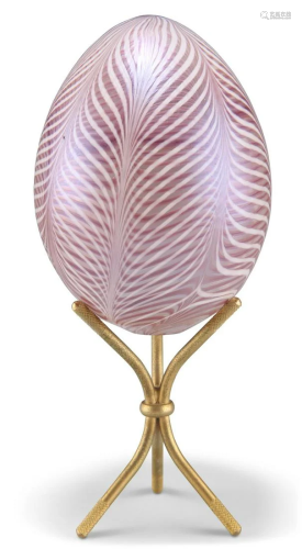 A DAUM GLASS EGG, of feather design, signed and indistinctly...