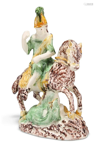 AN ENGLISH POTTERY FIGURE OF SAINT GEORGE SLAYING THE DRAGON...