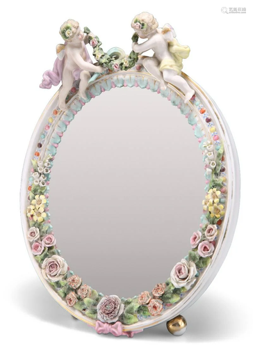 A 19TH CENTURY CONTINENTAL PORCELAIN MIRROR, the floral-encr...