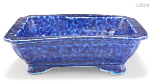 A CHINESE BLUE-GLAZED DISH, rectangular with inverted corner...