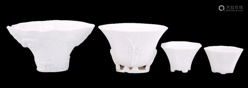 FOUR CHINESE DEHUA CUPS, including one moulded with prunus a...