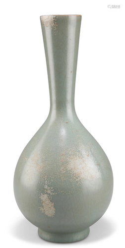 A CHINESE CELADON BOTTLE VASE, with reverse tapering neck. 2...