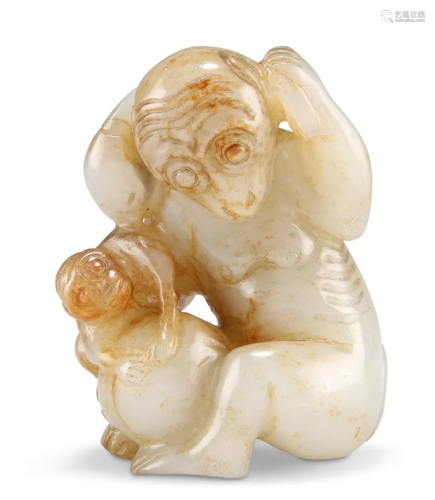 A CHINESE JADE MONKEY AND PEACH GROUP, carved and pierced de...