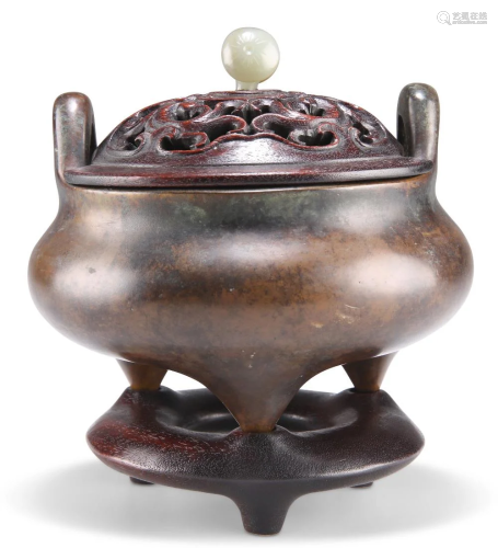 A CHINESE PATINATED BRONZE TRIPOD CENSER, of typical form, w...