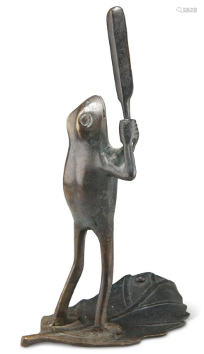 A BRONZE NOVELTY MODEL OF A CRICKETING FROG, cast with bat r...