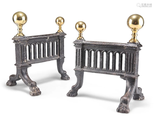 A PAIR OF 19TH CENTURY BRASS AND IRON FIRE DOGS, each with b...