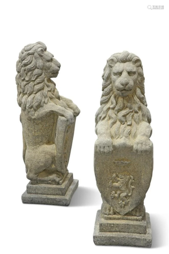 A PAIR OF RECONSTITUTED STONE HERALDIC LIONS, in the Beaumar...