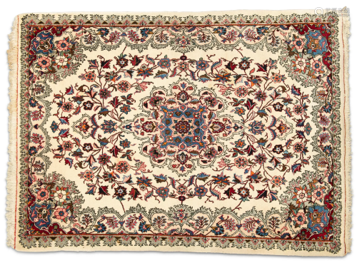 A NORTH PERSIAN RUG, hand-knotted, the cream field with scro...
