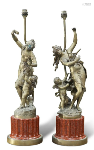 A PAIR OF BRONZE FIGURAL TABLE LAMPS, each cast with Classic...