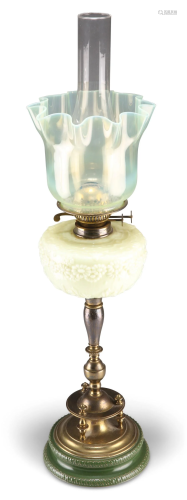 A LATE VICTORIAN BRASS AND VASELINE GLASS OIL LAMP, the rese...