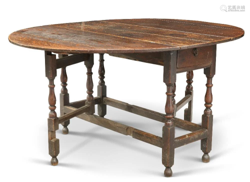 AN 18TH CENTURY OAK GATELEG DINING TABLE, with block and bal...