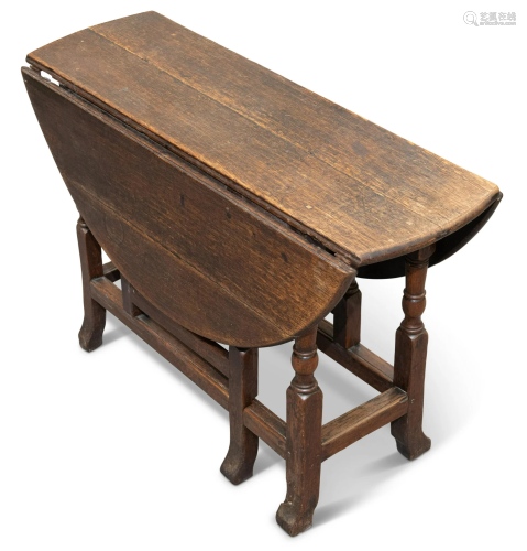 AN 18TH CENTURY OAK GATELEG DINING TABLE, with D-shaped leav...