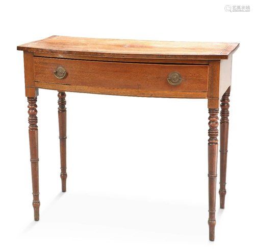 AN EARLY 19TH CENTURY MAHOGANY BOW-FRONT SIDE TABLE, with in...