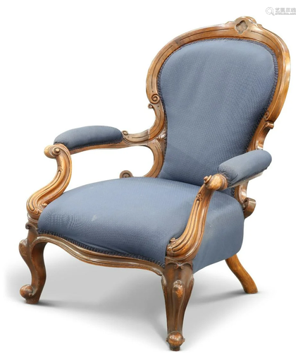 A VICTORIAN WALNUT AND UPHOLSTERED ARMCHAIR, with scroll-car...