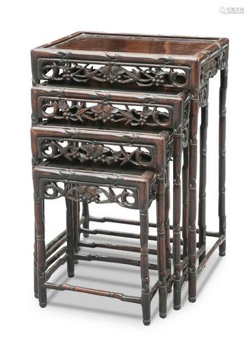 A SET OF FOUR CHINESE HARDWOOD NESTING TABLES, CIRCA 1900, r...