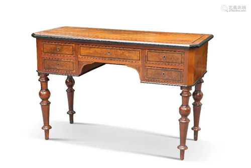 A CONTINENTAL EBONISED AND WALNUT DESK, the rectangular top ...