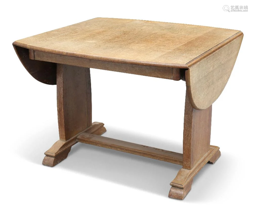 AN ARTS AND CRAFTS OAK DROPLEAF SUPPER TABLE, the boat-shape...