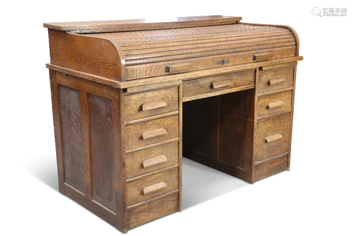 A 20TH CENTURY OAK TAMBOUR ROLL TOP DESK, the shallow tambou...