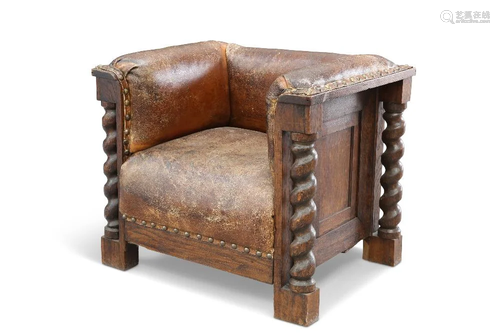 AN EARLY 20TH CENTURY OAK AND LEATHER CLUB CHAIR, with boldl...