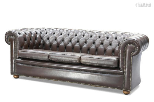 A CHESTERFIELD DEEP-BUTTONED BROWN LEATHER SOFA, with three ...