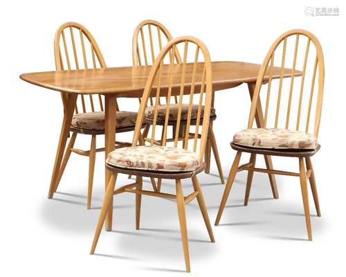 AN ERCOL LIGHT ELM DINING TABLE AND FOUR CHAIRS, the table w...